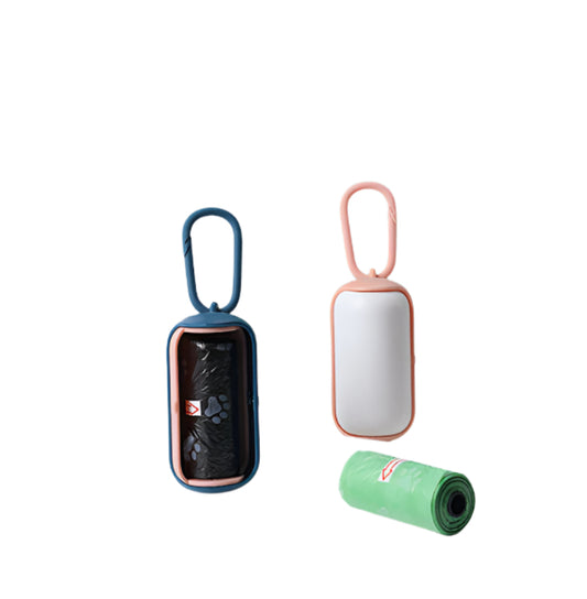 Two portable trash cans with carrying handles on a light surface against a green wall.